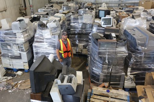 Brandon Sun Blake Hallett, a civic employee at the city's landfill site, walks among the stacks of electronic waste turned in for recycling. Recycling and specialized disposal keeps the heavy, toxic metals used in electronics out of the ecosystem.  FOR JILLIAN STORY (Colin Corneau/Brandon Sun)
