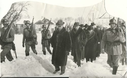 Winnipeg Free Press Archives If Day - World War II - (14) Feb. 19, 1942 Nazi Storm Troopers Demonstrate Invasion Tactics Premier Bracken, Hon. Errick Wills and other members of the cabinet and civic officials on their way to cells at Lower Fort Garry. fparchive