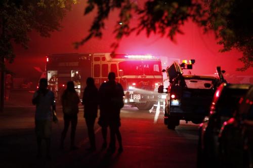 August 1, 2012 - 120801  -  Neighbours watch as firefighters fight a fire at 70 Cameo Crescent Wednesday August 1, 2012. John Woods / Winnipeg Free Press