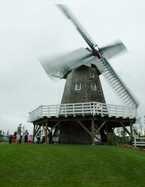 120804 Winnipeg - A windmill turns on a rainy Saturday during Pioneer Days at the Mennonite Pioneer village in Steinbach. August 3 2012. COLE BREILAND / WINNIPEG FREE PRESS