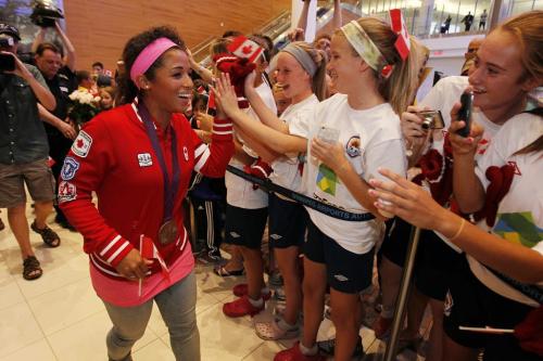 Soccer Olympian and bronze medalist Desiree Scott is welcomed home at Winnipeg Richardson International Airport Monday, August 13, 2012. (John Woods/Winnipeg Free Press)