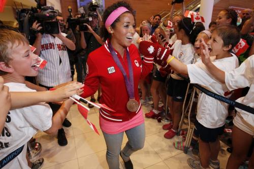 Soccer Olympian and bronze medalist Desiree Scott is welcomed home at Winnipeg Richardson International Airport Monday, August 13, 2012. (John Woods/Winnipeg Free Press)