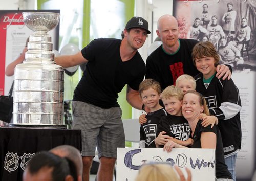 Kenora cheers on L.A. Kings' Mike Richards where he brough the Stanley cup home today. Thousands of fans gathered at the Harbourfront to see the Stanley Cup. Here Dennis and Beth Chevalier brough their kids and nephews to pose for a photo with Richards and the Cup. The kids are L-R Jack Bush, Reed Chevalier, Everett Chevalier, and Jake Bush.August 18, 2012  BORIS MINKEVICH / WINNIPEG FREE PRESS