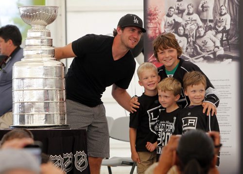 Kenora cheers on L.A. Kings' Mike Richards where he brough the Stanley cup home today. Thousands of fans gathered at the Harbourfront to see the Stanley Cup. The kids are L-R Jack Bush, Reed Chevalier, Everett Chevalier, and Jake Bush(top older kid).August 18, 2012  BORIS MINKEVICH / WINNIPEG FREE PRESS
