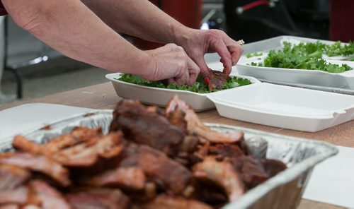 The çorrect preparation of BBQ ribs is demonstrated for newer competitors at the BBQ and Blues Festival at the Red River Ex grounds on Saturday. The Pit Masters Championships, sanctioned by the Kansas City BBQ Society, runs Sunday all day. 120818 - Saturday, August 18, 2012 -  Melissa Tait / Winnipeg Free Press