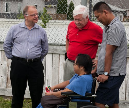 Bob Axworthy (left) and Bob Rae, federal interim Liberal leader, speak with Fort Whyte residents at a community BBQ at the Whyte Ridge Community Centre on Saturday. Rae was in town to help the campaign of Bob Axworthy, who is the Manitoba Liberal candidate in the Fort Whyte byelection this September.  120818 - Saturday, August 18, 2012 -  Melissa Tait / Winnipeg Free Press