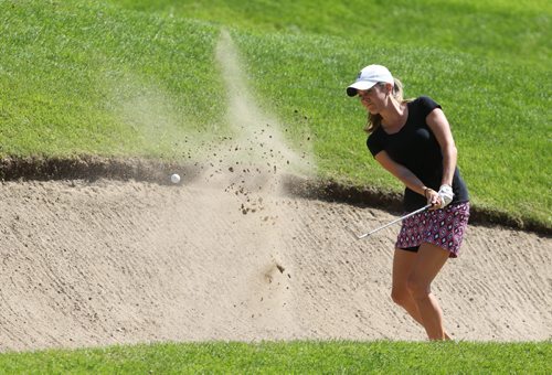 Brandon Sun Kaitlin Troop plays her second shot from the sand trap on the 17 hole at the Tamarack golf tournament at the Clear Lake Golf Course on Monday. (Bruce Bumstead/Brandon Sun)