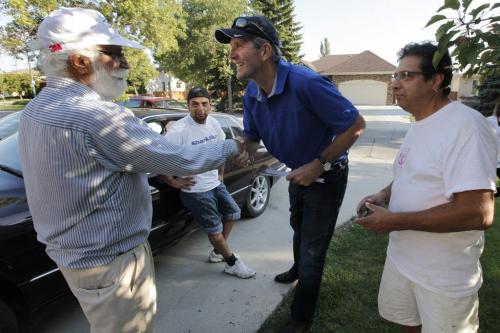 August 21, 2012 - 120821  -  Brian Pallister, leader of the provincial Conservative Party, talks with Mohinder Nijjar (L), William Briceno (m), and Moises Briceno as he canvases in Lindenwoods Tuesday August 21, 2012. Pallister is running in a by-election September 4 for the seat left vacant by Hugh MacFadyen John Woods / Winnipeg Free Press
