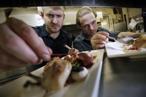 August 21, 2012 - 120821  - Scott Bagshaw, chef and owner of Deseo, and his sous chef Mike Robins (R) put the finishing touches on some young chicken and seared scallops Tuesday August 21, 2012. John Woods / Winnipeg Free Press