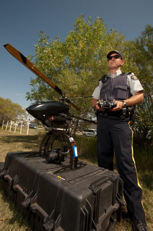 20120823 Winnipeg -  Corporal Bryon Charbonneau of the RCMP's forensic collision reconstronction unit stands with a new custom drone unit that the RCMP will use investigating traffic incidents. August 22 2012 (COLE BREILAND / WINNIPEG FREE PRESS)