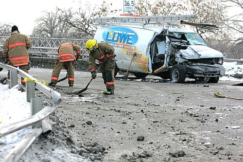 BORIS MINKEVICH / WINNIPEG FREE PRESS  070305 MVC at the foot of the Louise Bridge on the Nairn St. side. A 5 ton truck, not in photo, hit the rail and slammed into a work van.