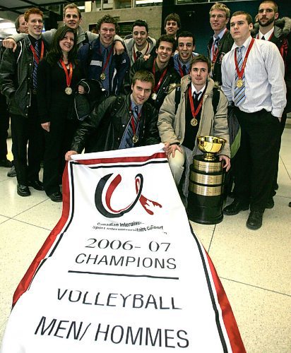 BORIS MINKEVICH / WINNIPEG FREE PRESS  070305 The Winnipeg Wesman volleyball team back in the Peg. Photo taken at the airport. The team poses.