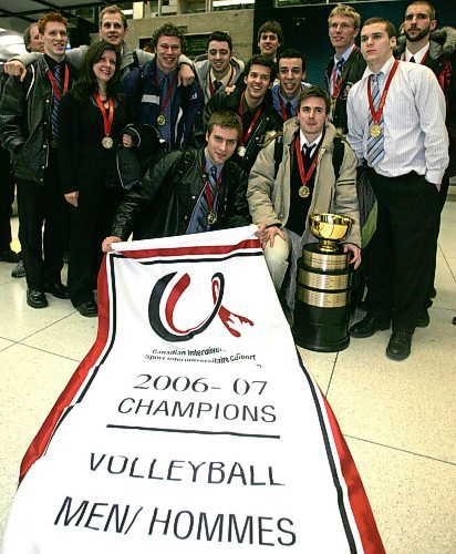 BORIS MINKEVICH / WINNIPEG FREE PRESS 070305 The Winnipeg Wesman volleyball team back in the Peg. Photo taken at the airport. The team poses.