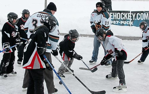 BORIS MINKEVICH / WINNIPEG FREE PRESS  070306 Some Manitoba Moose play some hockey at a backyard rink in south St. Vital. Moose Lee Goren  and Json Jaffray.