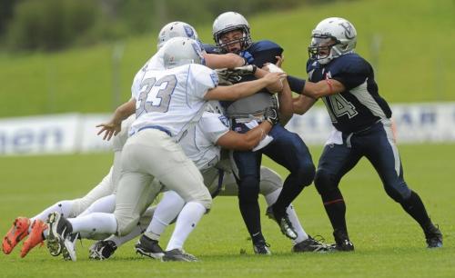 Villanova College's Alexander Montini Breaks through the Oak Park Raiders defense with a little help from his QB Andrew Samese, Friday, Aug. 31, 2012 in Pairc Tailteann in Navan, County Meath, about 50 kilometres north of Dublin. The game was part of the Global Football tournament in Ireland. Oak Park (Winnipeg) and Villanova College (King City, Ont.) were the two Canadian teams who joined 12 other U.S. high schools to promote football overseas. Pat Murphy / SPORTSFILE  ***NO REPRODUCTION FEE***