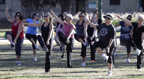 About 40 people participate in a Zumba-thon in Memorial park, raising funds for the Noeth Point Douglas Women's Centre, Sunday, September 9, 2012. (TREVOR HAGAN/WINNIPEG FREE PRESS)