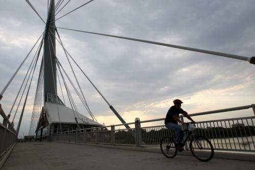 Cyclist rides over the Esplanade-Riel-pedestrian-bridge over the Red River Tuesday morning during a  seasonable cool morning- Standup photo September 11, 2012   (JOE BRYKSA / WINNIPEG FREE PRESS)