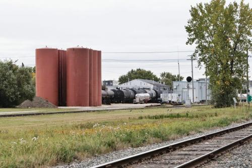 Eight large silos rise above the tree line between the tracks on the BNSF Railway line property close to Mathers Ave and Lindsay St. In River Heights.  120917 September 17, 2012 Mike Deal / Winnipeg Free Press