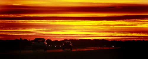September 17, 2012 - 120917  -  People drive off into the sunset just west of Headingley, Manitoba Monday September 17, 2012.  John Woods / Winnipeg Free Press