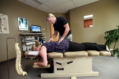 Winnipeg Chiropractor Dr. Greg Stewart, with a client at his office on St. Annes Rd.  See Larry Kush story. Sept 17,  2012 (Ruth Bonneville/Winnipeg Free Press)