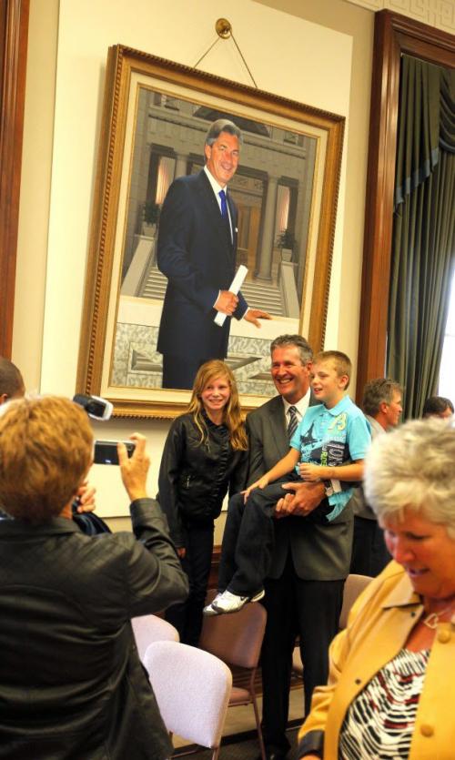 Brian Pallister is sworn into the Manitoba Leg and is now the official oposition leader. There was a cerimony at the Leg.  Here old Gary Doer looks over his shoulder as he poses for a photo with some relitaves. September 19, 2012  BORIS MINKEVICH / WINNIPEG FREE PRESS