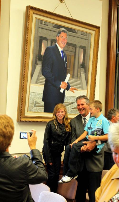 Brian Pallister is sworn into the Manitoba Leg and is now the official oposition leader. There was a cerimony at the Leg.  Here old Gary Doer looks over his shoulder as he poses for a photo with some relitaves. September 19, 2012  BORIS MINKEVICH / WINNIPEG FREE PRESS