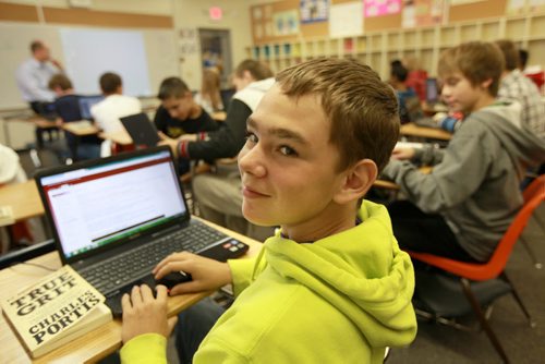 Grade ten language arts student John Fieber works on his laptop with hsi classmates at Dakota Collegiate Wednesdsay morning, laptops are compulsory for them to have  as part of their school supplies.  See Nick Martin story. Sept 19,  2012 (Ruth Bonneville/Winnipeg Free Press)