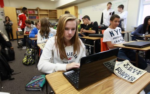 Grade ten language arts student  Janessa Turner works on her laptop with her classmates at Dakota Collegiate Wednesdsay morning, laptops are compulsory for them to have  as part of their school supplies.  See Nick Martin story. Sept 19,  2012 (Ruth Bonneville/Winnipeg Free Press)