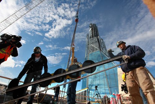 Building crews working on the Canadian Museum of Human Righs prepare to hoist the final piece of glass up to the chimney area of the Tower of Hope  which is 328 feet high on Wednesday morning. Sept 20,  2012 (Ruth Bonneville/Winnipeg Free Press) CMHR