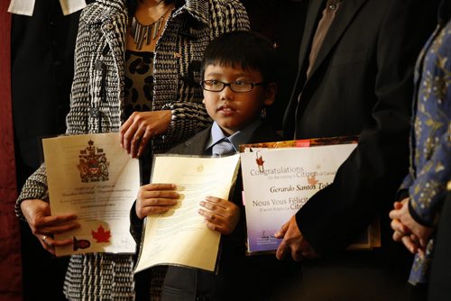 In pic 8 year old  Rafael Tobias   with his citzenship papers , he took the oath with his father Gerardo , mother Elizabeth and brother Gerald  . Citizenship Judge Harold Gilleshammer welcomed 40 new Canadian citizens  with a ceremony he presided over at the Manitoba Legislature . The ceremony had Premier Greg Selinger and  Immigration & Multiculturalism Christine Melnick also took part as a speacial Diamond Jubilee ceremony - with story by Jenny   KEN GIGLIOTTI /  WINNIPEG FREE PRESS /  Feb. 14 2012 ( Ken 2012  calendar  kg2012calendar )