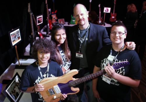 Wayne Davies principal of École Selkirk Junior High School and grade 8 students from left, Jacob Whettell, Jamey Smith and Logan Lamoureux  involved in the B.O.S.S. Guitar Works Program at their school hold a guitar made by students autographed by Jeff Beck at the announcement the Friends of the Canadian Museum for Human Rights raised a  total of $136 million in private donations. The B.O.S.S. Guitar Works also kicked off their fundraising Guitar Auction and Gala 2.0 event that will be held in the Selkirk Rec. Centre on Thursday May 30 2013 where aprox. 70 signed guitar by performers, celebrities and athletes will be auctioned off with the majority of the funds raised going to the Canadian Museum for Human Rights.   see release/ with Paul Williamson story     (WAYNE GLOWACKI/WINNIPEG FREE PRESS) Winnipeg Free Press  Sept. 25  2012