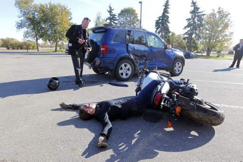 A mock car crash was conducted today on the parking lot of the Chapel Lawn funeral home on Portage Avenue. The crash was to remind more than 200 students from Nelson McIntyre Collegiate, Tec Voc, College Louis Riel and Fisher Branch of the dangers of impaired driving. Photo taken at Chapel Lawn Funeral Home. September 26, 2012  BORIS MINKEVICH / WINNIPEG FREE PRESS