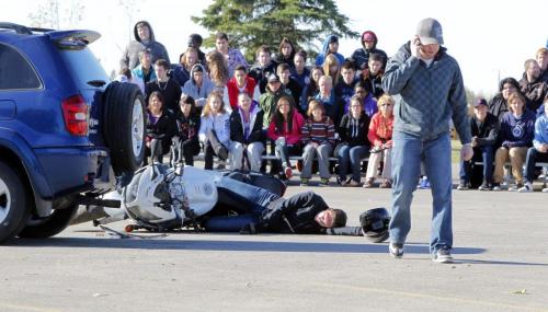 A mock car crash was conducted today on the parking lot of the Chapel Lawn funeral home on Portage Avenue. The crash was to remind more than 200 students from Nelson McIntyre Collegiate, Tec Voc, College Louis Riel and Fisher Branch of the dangers of impaired driving. Photo taken at Chapel Lawn Funeral Home. September 26, 2012  BORIS MINKEVICH / WINNIPEG FREE PRESS