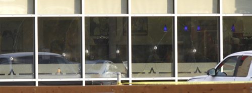 Bullet holes in the front windows of the  Salisbury House Rest. on Pembina Hwy. where two men were shot early Thursday morning. web story     (WAYNE GLOWACKI/WINNIPEG FREE PRESS) Winnipeg Free Press  Sept. 27  2012