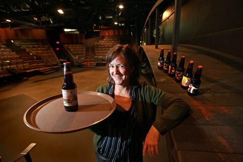 The playwright is Ellen Peterson showcases a bottle labeled with her play "The Brink" which opens next week. Prairie Theatre Exchange in Portage Place. PTE is celebrating its 40th anniversary and is having specially made labels for the beer it sells this season. There are seven labels depicting its best known plays. The first one is of The Brink, which opens its season next week Oct 03,  2012 (Ruth Bonneville/Winnipeg Free Press)
