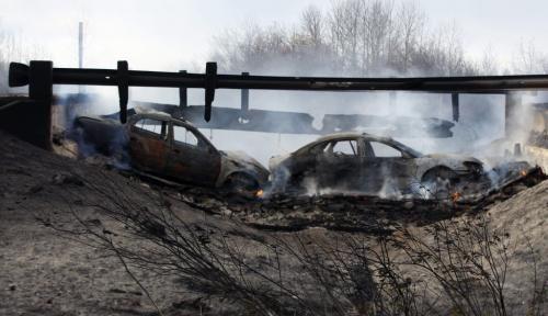 Cars still burning  a day later- Vita wild fire destroys  a bridge causing two cars  to crash in heavy smoke also two  near by  homes ,next to each other on Winchester Rd. In pic Margaretha  and Jacob  Martens inspect their totally destroyed home Äì also video  KEN GIGLIOTTI  / WINNIPEG FREE PRESS  /  OCT. 3 2012