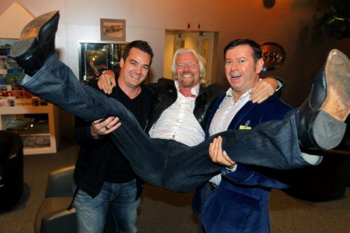 Sir Richard Branson is hoisted by Virgin Radio Winnipeg Brand Director Dale Davies and Virgin Radio Canada's Executive VP of Content Programming Rob Farina upon his arrival in Winnipeg. Photo taken at Esso Avitat where all the private jets land. He's in town for some charity event. October 4th, 2012  BORIS MINKEVICH / WINNIPEG FREE PRESS