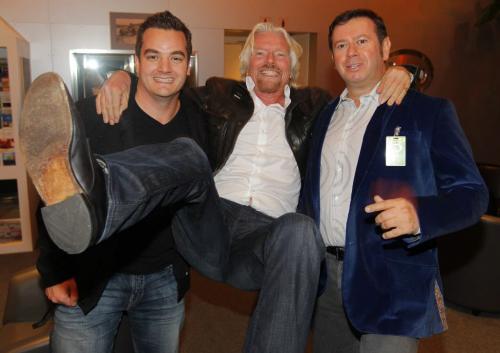 Sir Richard Branson is hoisted by Virgin Radio Winnipeg Brand Director Dale Davies and Virgin Radio Canada's Executive VP of Content Programming Rob Farina upon his arrival in Winnipeg. Photo taken at Esso Avitat where all the private jets land. He's in town for some charity event. October 4th, 2012  BORIS MINKEVICH / WINNIPEG FREE PRESS