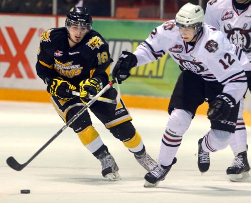 Brandon Sun Brandon Wheat Kings' Richard Nejezchleb and Red Deer Rebels' Colten Mayor wrangle for the puck during WHL action, Saturday night at Westman Place. (Colin Corneau/Brandon Sun)