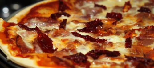 Corrientes Argentine Pizzeria review. Crudo pizza has Prosciutto, Buffalo Mozzarella and Sun Dried Tomato on it. October 9, 2012  BORIS MINKEVICH / WINNIPEG FREE PRESS
