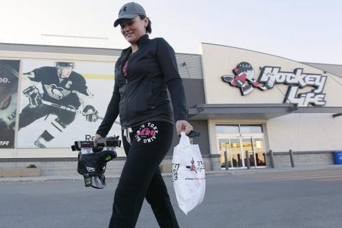 October 14, 2012 - 121014  -  Kali Leary takes advantage of Sunday shopping and buys some hockey gear at a St James store Sunday October 14, 2012.  John Woods / Winnipeg Free Press