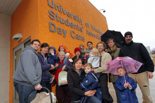 UW day care on Furby Place, between Furby and Langside north of Portage, a group of parents and kids pose in front of the daycare. Goes with story for tomorrow on UW decision to move transit bus loop from Spence and Young, to Furby and Langside.  October 18, 2012  BORIS MINKEVICH / WINNIPEG FREE PRESS