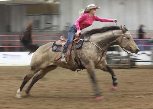 Brandon Sun Kelsey Wheeler makes her run during Thursday's barrel racing competition at the Wheat City Stampede at the Westoba Agriculture Centre of Excellence. (Bruce Bumstead/Brandon Sun)