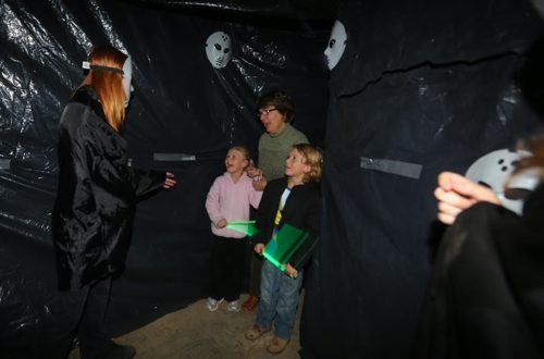 Brandon Sun A young visitor to the Big Brothers and Big Sisters' Haunted House lets out a scream as she enters a dark room during Thursday's opening night at the former Convergys building. (Bruce Bumstead/Brandon Sun)