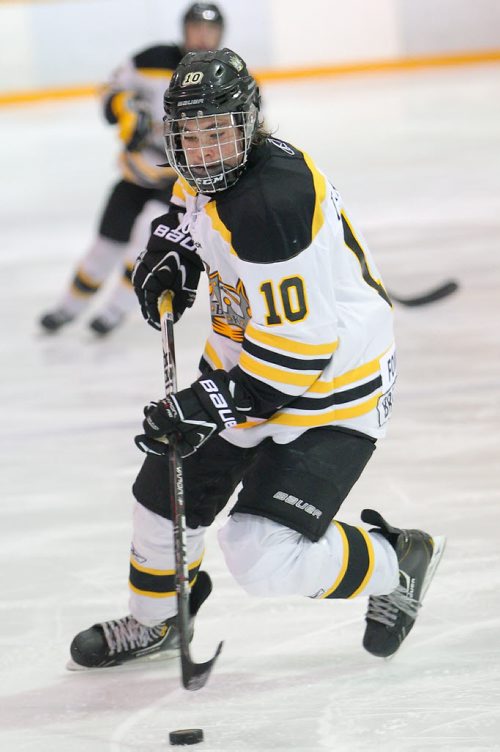 Brandon Sun 21102012 Tanner Kaspick #10 of the Brandon Midget AAA Wheat Kings moves the puck during Manitoba AAA Midget Hockey League action against the Central Plains Capitals at the Sportsplex on Sunday.(Tim Smith/Brandon Sun)