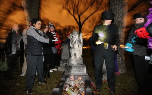 Kristen Verin-Treusch, right, leads one of her Haunted Winnipeg tours through the Elmwood Cemetery, Thursday, October 25, 2012. (TREVOR HAGAN/WINNIPEG FREE PRESS) - see roseanna schick story - sunday Xtra