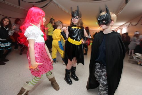 Brandon Sun 27102012 Eight-year-old Shae-lynne Stewart (C) dances up a storm with other children during the MADD Kid's Fab-BOO-lous Halloween Dance at the South End Community Centre on Saturday afternoon. The dance included door prizes, hot dogs and snacks, games and prizes for the best costumes and dancers. All proceeds went to the Brandon MADD chapter. (Tim Smith/Brandon Sun)(Tim Smith/Brandon Sun)