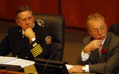 Left Wpg Fire Chief Reid Douglas  and Right City CAO Phil Sheegl  attend the meeting to address how  an extra $2.2 million was added to the construction cost of Fire Hall #11  located a Portage Ave  at the Route 90 overpass - STDUP City Hall Protection Committee meeting - KEN GIGLIOTTI  / WINNIPEG FREE PRESS  / Oct 29 2012