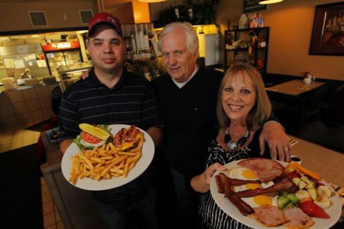 The Seine River Cafe. Sanderson story. Doug Torgerson, centre, with his son Todd and Wife Lori pose for a photo in the restaurant. October 29, 2012  BORIS MINKEVICH / WINNIPEG FREE PRESS