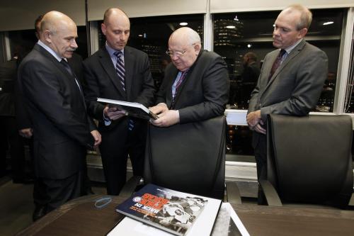 October 29, 2012 - 121029  -  Former Russian president Mikhail Gorbachev with his translator (L), looks over the the book The Way We Live in Manitoba with Paul Samyn and Bob Cox Monday October 29, 2012 at the Radisson Hotel. Gorbachev is a speaker at We Day in Winnipeg. John Woods / Winnipeg Free Press